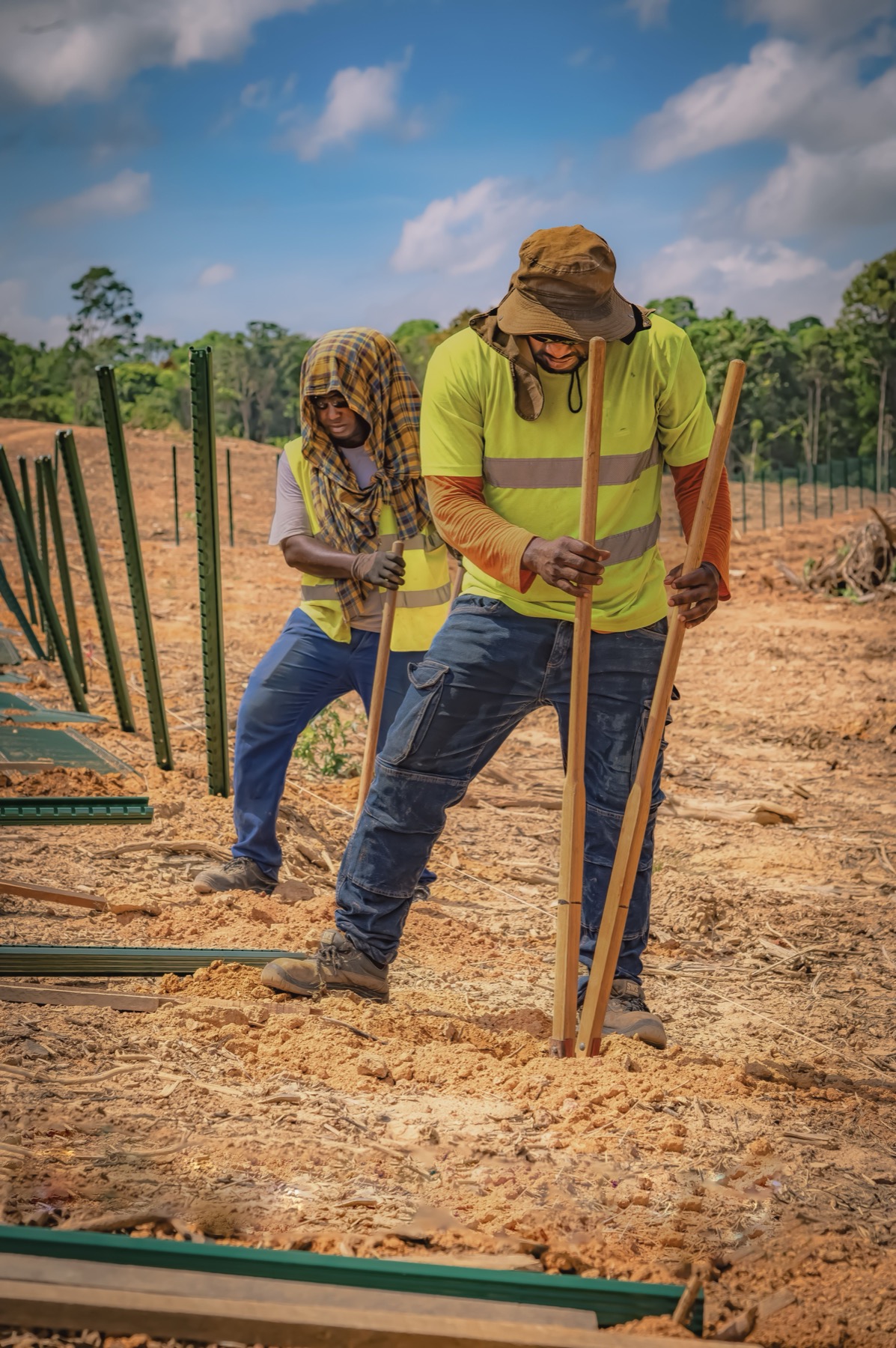 Fence installers building a residential fence