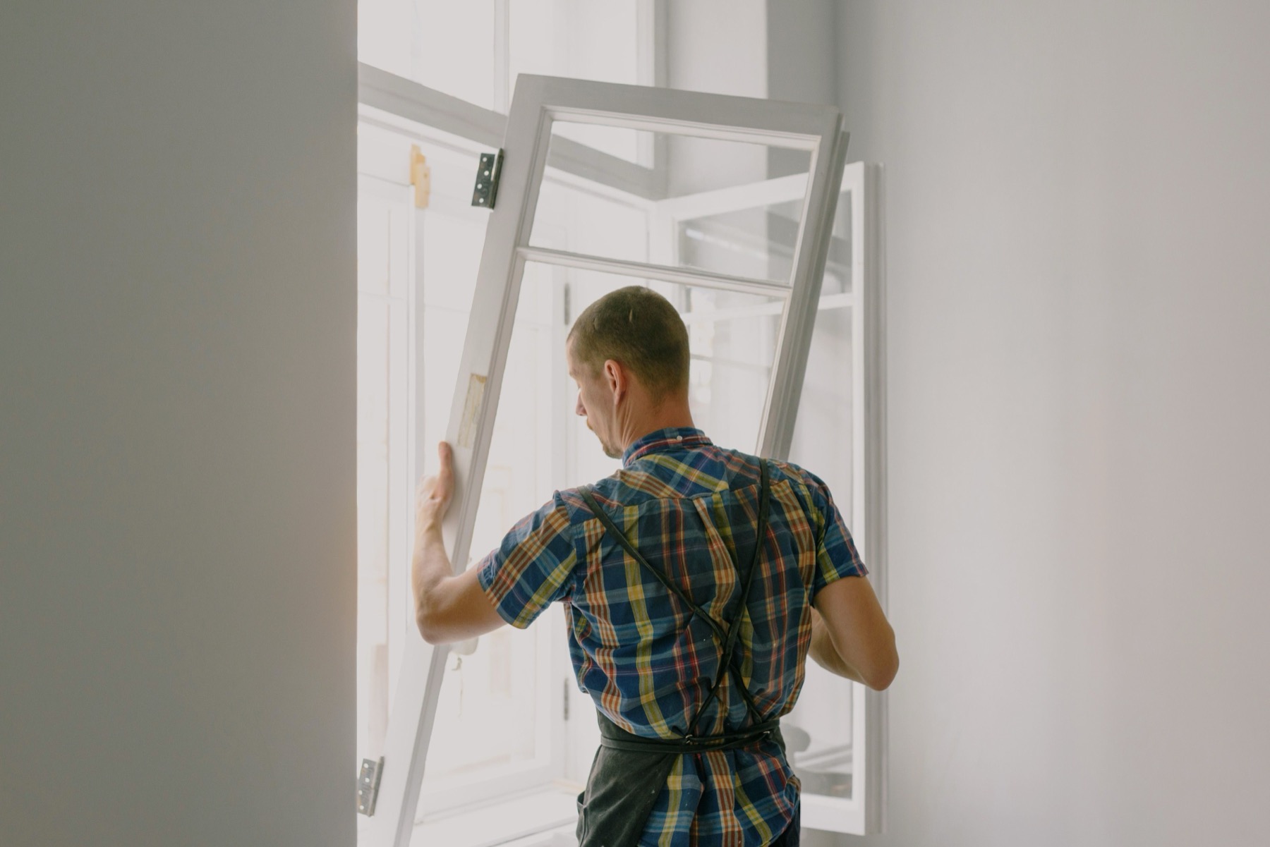 Installer fitting a residential window